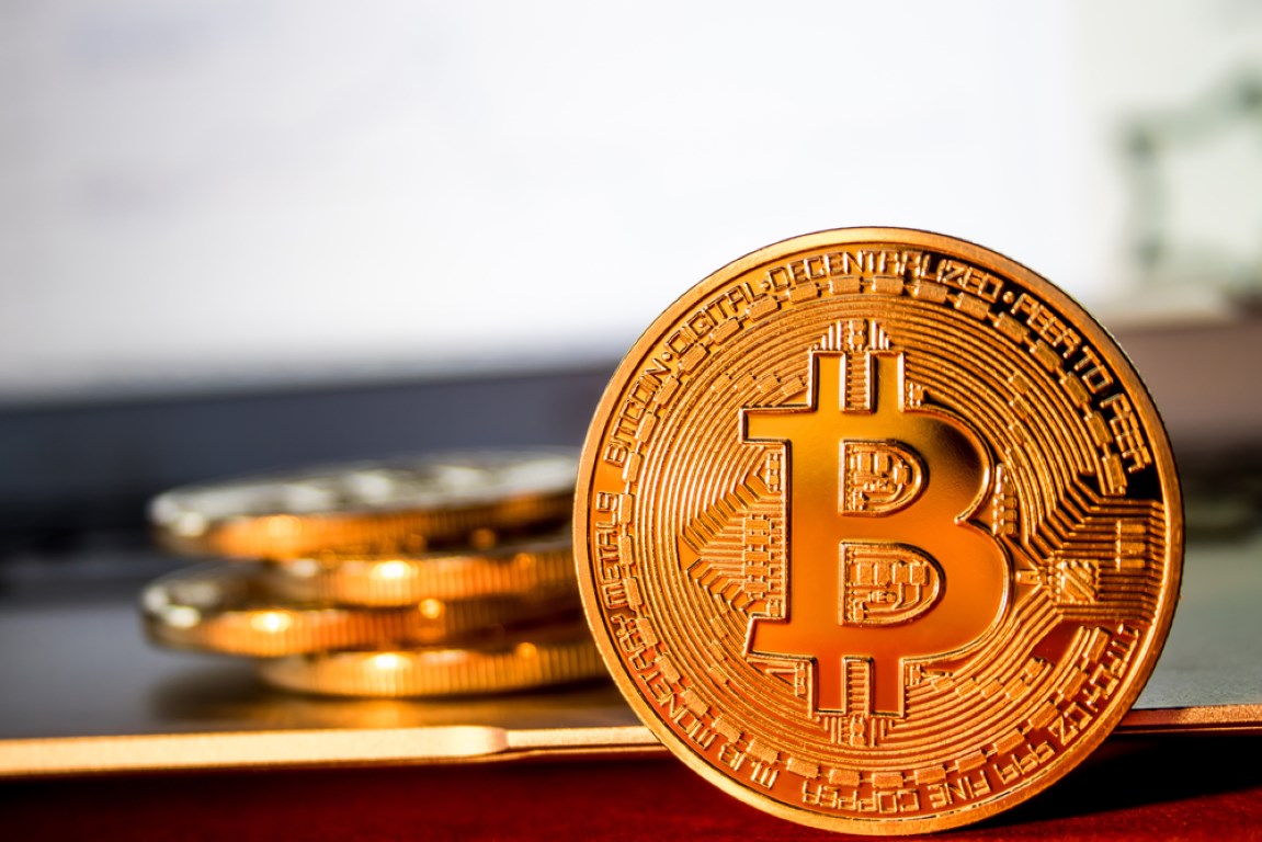 Bitcoin surges past $12,000