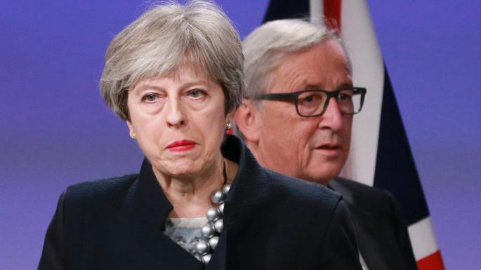 May threatens EU over deal
