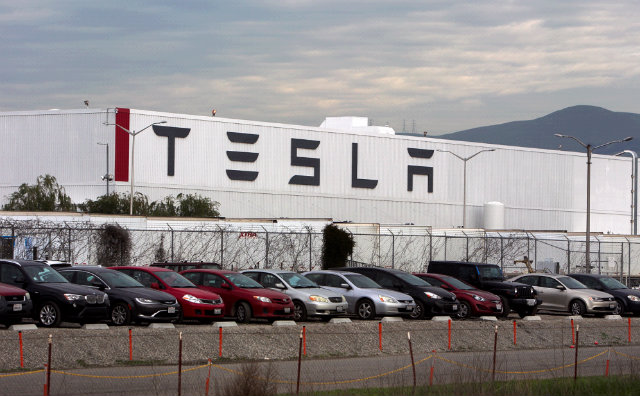 Tesla cuts 9% of workforce